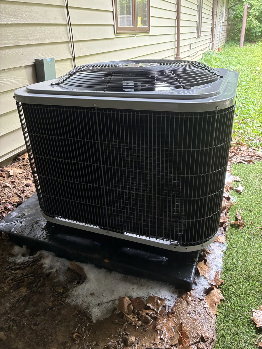 Side of condenser unit after cleaning.